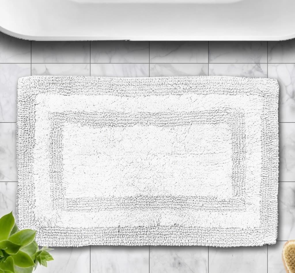 Plush White Bath Mat with Elegant Border Design