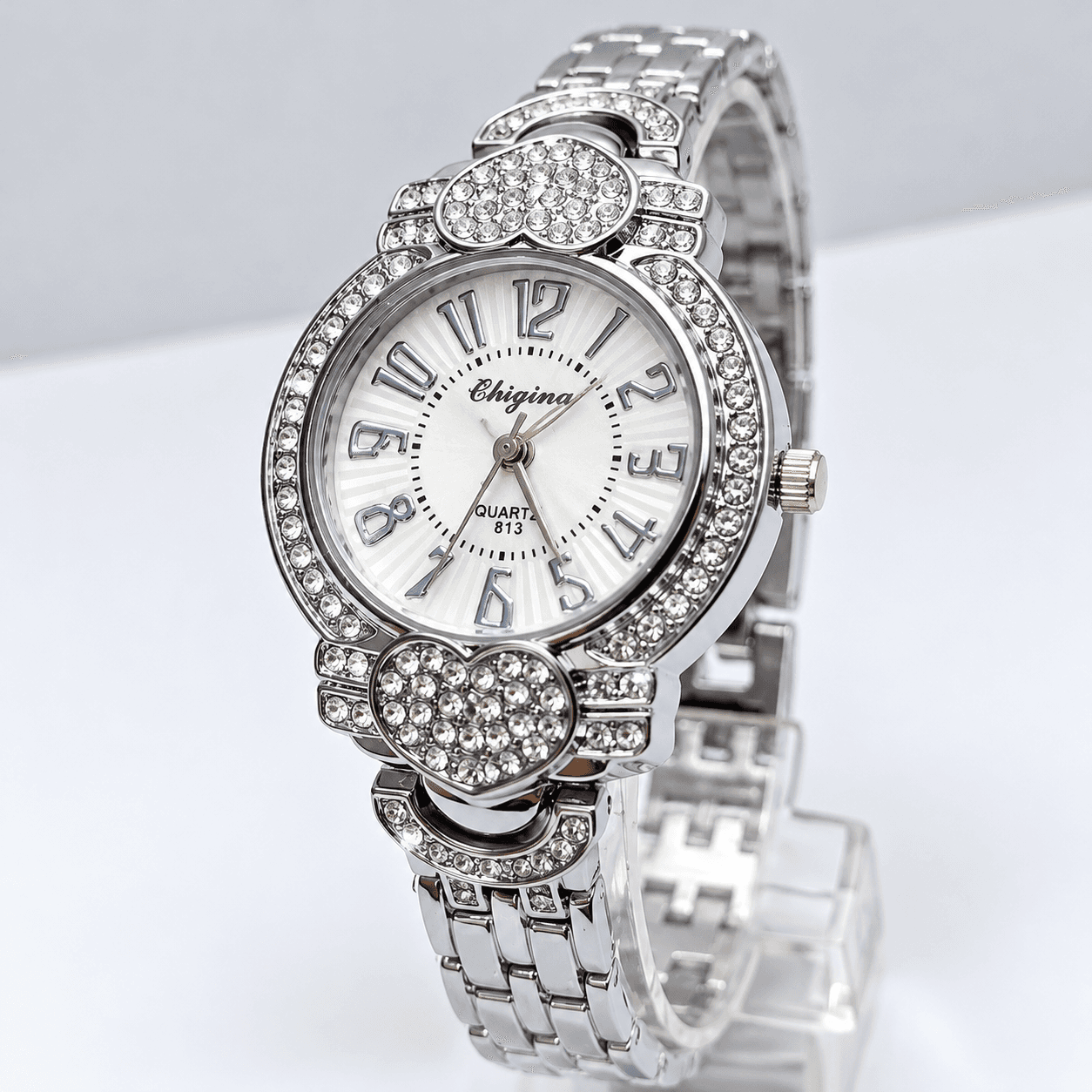 Luxury Silver Crystal Women’s Watch – Elegant Rhinestone Bezel, Heart Detail Design, White Dial & Stainless Steel Bracelet…